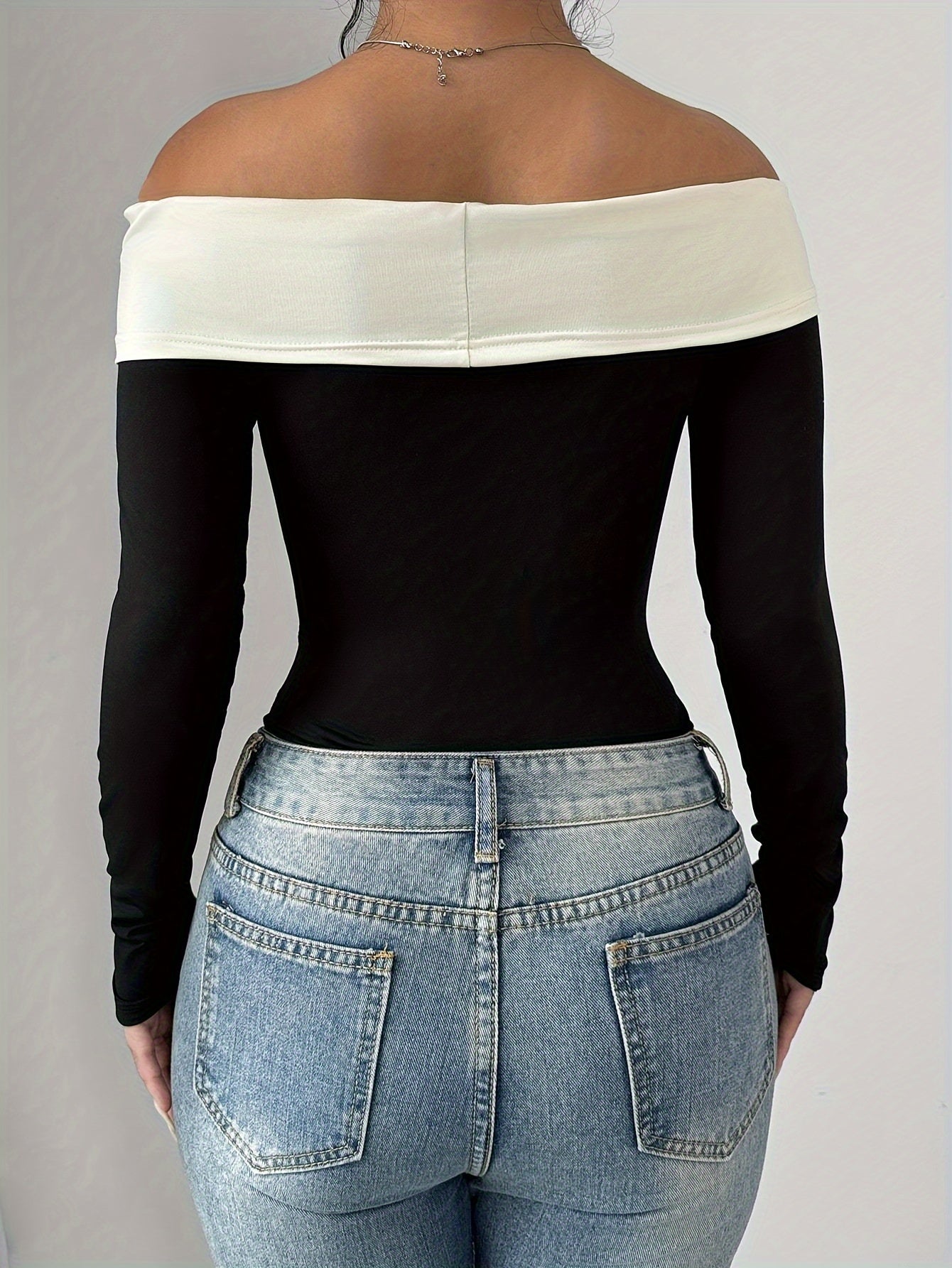 Chic Off-Shoulder Color Block Bodysuit with Bow Detail
