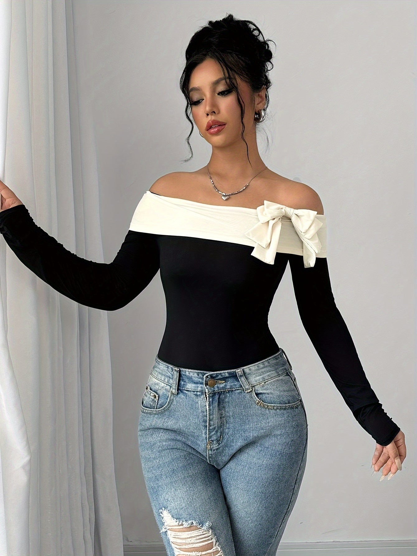 Chic Off-Shoulder Color Block Bodysuit with Bow Detail